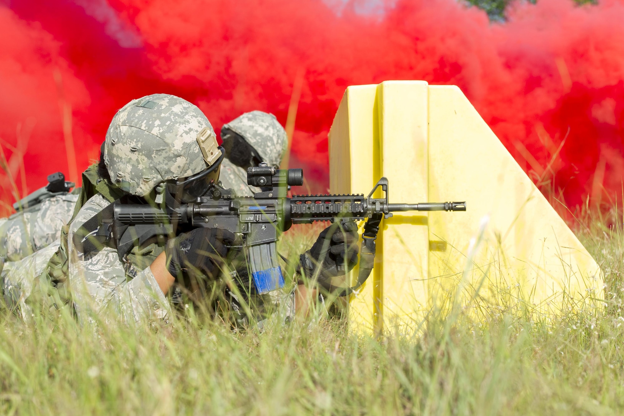 Reserve Citizen Airmen from the 482nd Security Force Squadron, Homestead Air Reserve Base, Florida, take cover and return fire while participating in a shoot, move, and communicate training with sim-munitions on September 26, 2017.  This annual training for security forces members helps keep the airmen proficient in many situation they may encounter stateside or overseas. (U.S. Air Force photo by Staff Sgt. Kyle Brasier)