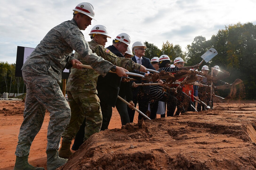 Military and civilian officials participate in a groundbreaking ceremony for a school building on Vogelweh Military Complex, Germany, Sept. 29, 2017. The U.S. Department of Defense Education Activity is pushing an initiative to establish more student-centered and energy efficient schools. (U.S. Air Force photo by Airman 1st Class Joshua Magbanua)