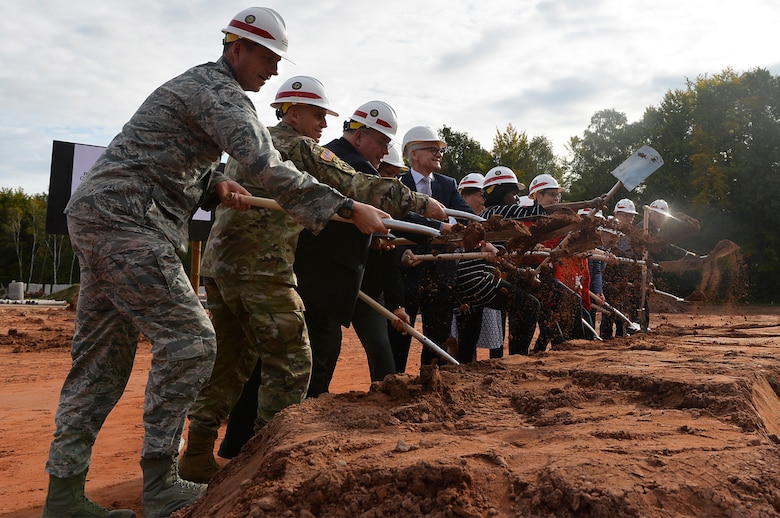 Military and civilian officials participate in a groundbreaking ceremony for a school building on Vogelweh Military Complex, Germany, Sept. 29, 2017. The U.S. Department of Defense Education Activity is pushing an initiative to establish more student-centered and energy efficient schools. (U.S. Air Force photo by Airman 1st Class Joshua Magbanua)