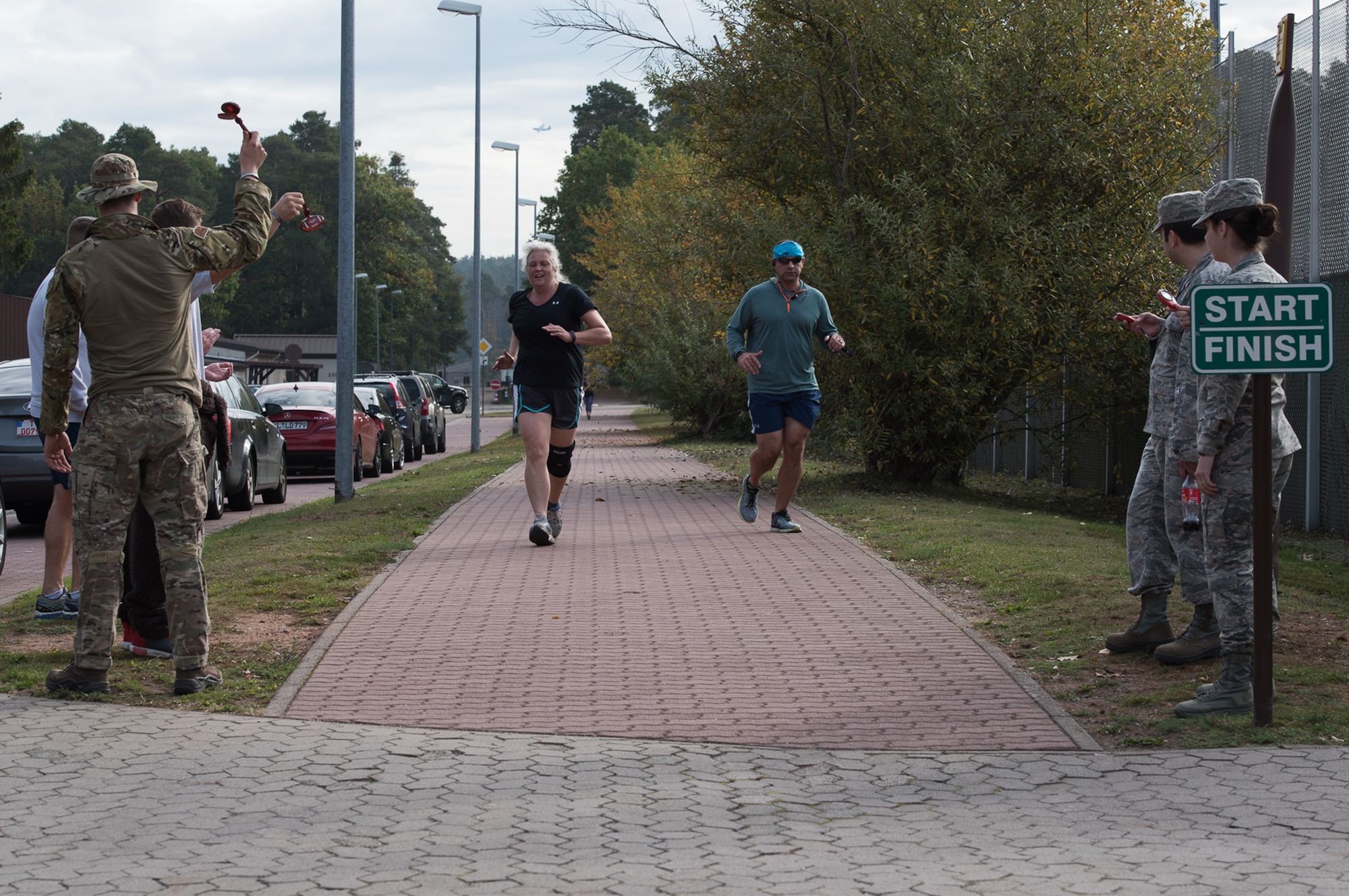 Members of the Kaiserslautern Military Community cross the finish line during the National Preparedness Month 5k Run on Ramstein Air Base, Germany, Sept. 29, 2017. This year’s overarching theme was, “Disasters don’t plan ahead. You can.” (U.S. Air Force photo by Airman 1st Class Devin M. Rumbaugh)