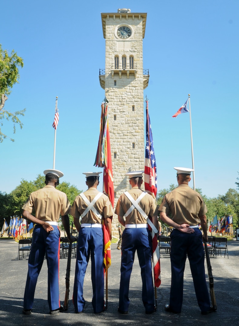 Marines from the 3rd Assault Amphibian Battalion, Camp Pendleton, Calif., prepare to parade the colors for an award ceremony in the historical quadrangle at Joint Base San Antonio-Fort Sam Houston Sept. 8. Marine Corps veteran Cpl. Randy D. Mann was awarded the Navy and Marine Corps Medal during the ceremony in his hometown of San Antonio for his actions while on active duty with the 3rdAssault Amphibian Battalion in July 2013.