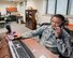 U.S Air Force Master Sgt. Rolan Tuazon, left, and his twin brother Master Sgt. Rico Tuazon assigned to the 60th Communications Squadron, pose for a photo in their office at Travis Air Force Base, Calif., Sept. 20, 2017. The Brothers who are both stationed at Travis are the same rank, assigned to the same squadron and share the same office. (U.S. Air Force photo by Louis Briscese)