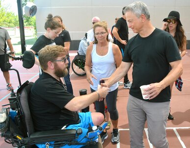 Gary Sinise shakes hands with Ed Matayka, wounded warrior, Sept. 15 at the Center for the Intrepid. Sinise and celebrity chef Robert Irvine returned to Brooke Army Medical Center for the fifth time to host the Invincible Spirit Festival for BAMC staff, patients and family members. The event included food, music and activities throughout the afternoon.