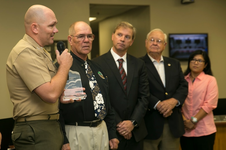 Col. Jay Wylie, assistant chief of staff, G-4 Installation and Logistics, speaks to members of the Mojave Desert Air Quality Management District at the MDAQMD headquarters, September 25, 2017. Wylie accepted an award on behalf of the Combat Center, which was granted to the installation for its dedication to using clean energy and reducing greenhouse gas emissions. (U.S. Marine Corps photo by Lance Cpl. Isaac Cantrell)