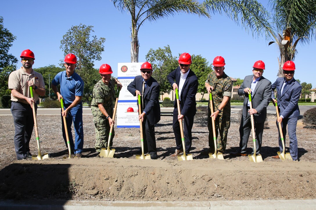 From left to right, Mick Wasco, Marine Corps Air Station Miramar energy program manager; Richard Johnston, Naval Facilities operations and maintenance officer; Lt. Cmdr. Travis Brinkman, MCAS Miramar public works officer; Dave Guebert, San Diego Gas and Electric federal account representative; Scott Kinner, Black & Veatch vice president; Col. Jason Woodworth, MCAS Miramar commanding officer; Andy Haun, Schneider Electric chief technology microgrids officer; and Howard Ou, Congressional Office general services fellow; break ground at the new microgrid project at MCAS Miramar, Calif., Sept. 28. MCAS Miramar and Naval Facilities Engineering Command have awarded an installation microgrid project to Schneider Electric and Black and Veatch as a joint venture. The project will utilize renewable energy to provide redundant power in the event of a local grid failure. “Having the ability to fully operate ensures we’re all about mission and making sure the young men and women who decided to serve their country can do what they came to do, and thats to train,” said Col. Jason Woodworth. Once fully operational, the microgrid will provide energy resiliency to the air station and allow operations at mission-critical facilities to continue if the utility San Diego area power grid is compromised or damaged. (U.S. Marine Corps photo by Sgt. Brytani Wheeler)