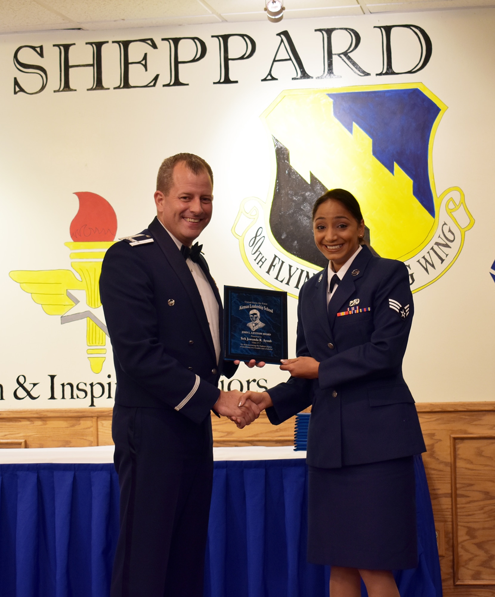Senior Airman Jowanda Ayoub, 445th Maintenance Group maintenance scheduler, is presented the John L. Levitow award at her Airman Leadership School graduation Sept. 21, 2017, Sheppard Air Force Base, Texas.