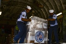 Members of the Mexican air force, navy, army and marine corps push pallets of hygiene items from a U.S. Air Force C-17 Globemaster III onto supply trucks Sept. 22 at Ixetepec Airport, Oaxaca, Mexico. At the request of Mexican civil authorities, the C-17 and its six-member crew from Travis Air Force Base, Calif., assisted U.S. efforts to provide humanitarian aid to Mexico by airlifting over 31,000 pounds of hygiene and medical supplies to the area after a 7.1-magnitude earthquake struck Mexico City Sept. 19. (U.S. Air Force photo / 2nd Lt. Sarah Johnson)