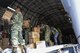 Members of the Mexican army form an assembly line to transfer boxes of hygiene supplies from a U.S. Air Force C-17 Globemaster III to a supply truck Sept. 22 at Ixetepec Airport, Oaxaca, Mexico. At the request of the Mexican government, the C-17 and its six-member crew from Travis Air Force Base, Calif., assisted U.S. efforts to provide humanitarian aid to Mexico by airlifting over 31,000 pounds of hygiene and medical supplies to the area after a 7.1-magnitude earthquake struck Mexico City Sept. 19. (U.S. Air Force photo / 2nd Lt. Sarah Johnson)