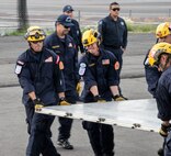Members of a U.S. Agency for International Development elite disaster team load cargo pallets onto a C-17 Globemaster III Sept. 23 at Benito Juárez International Airport, Mexico City, Mexico. At the request of the Mexican government, a C-17 from Travis Air Force Base, Calif., delivered the team to Mexico to support search and rescue efforts after a 7.1-magnitude earthquake struck the area Sept. 19. (U.S. Air Force photo / 2nd Lt. Sarah Johnson)