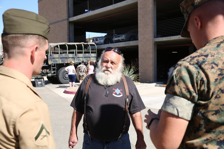 Marines with 3/11 speak to a member of the 3/11 Association and swap stories about their Marine Corps career aboard the Marine Corps Air Ground Combat Center in Twentynine Palms, Calif. September 21, 2017. The 3/11 Association is a program that keeps veterans together and involved in the Marine Corps after their service. (U.S. Marine Corps photo by Lance Cpl. Christian Lopez)