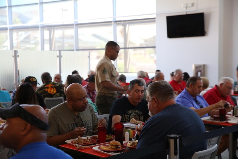 Veterans with 3/11 Association break bread with their brothers and sisters aboard the Marine Corps Air Ground Combat Center in Twentynine Palms, Calif., September 21, 2017. The 3/11 Association is a program that keeps veterans together and involved in the Marine Corps after their service. (U.S. Marine Corps photo by Lance Cpl. Christian Lopez)