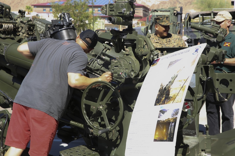 George Alberto Moran, Retired USMC, with the 3/11 Association checks out the M777A2 155mm Howitzer aboard the Marine Corps Air Ground Combat Center in Twentynine Palms, Calif. September 21, 2017. The 3/11 Association is a program that keeps veterans together and involved in the Marine Corps after their service. (U.S. Marine Corps photo by Lance Cpl. Christian Lopez)
