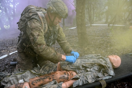 Staff Sgt. Joshua Merriss, 232nd Medical Battalion, treating a simulated burn victim during the tactical combat casualty care lane during the AMEDDC&S Best Medic Completion at Joint Base San Antonio-Camp Bullis Sept. 25-28.