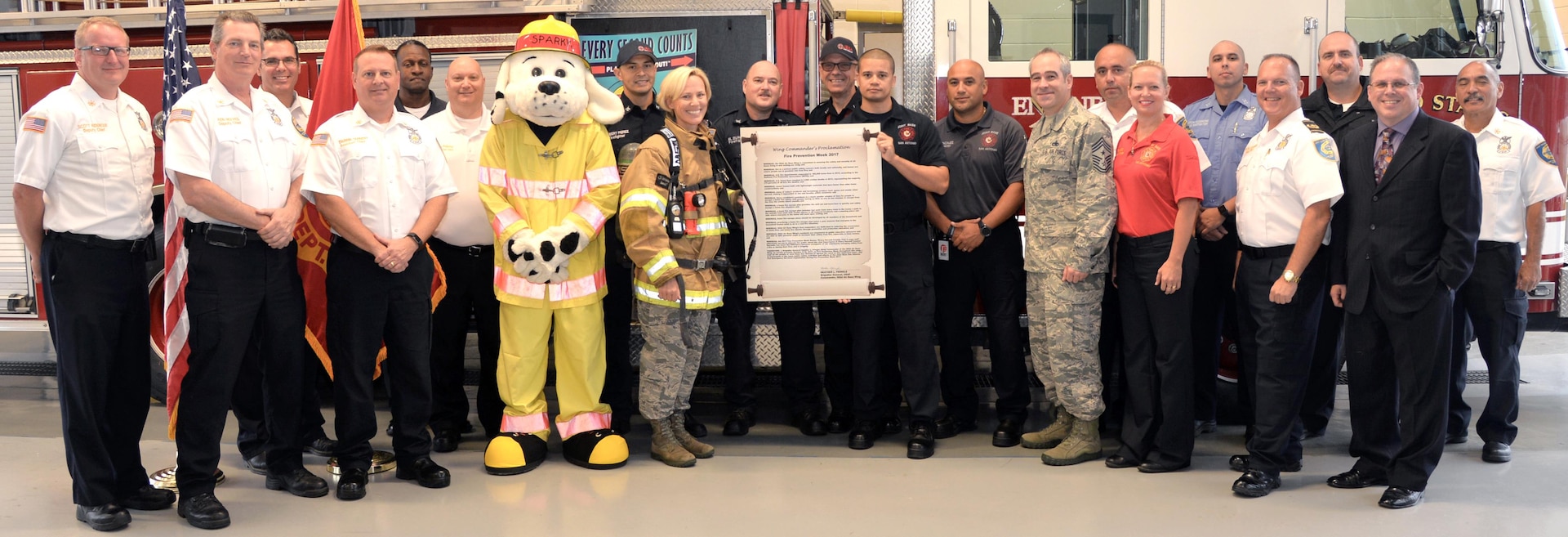 Brig. Gen. Heather Pringle, commander, 502nd Air Base Wing and Joint Base San Antonio, signs the Fire Prevention Week proclamation at Fire Station No. 1 at Joint base San Antonio-Fort Sam Houston Sept. 27.