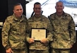Staff Sgt. Anthony Johnson (middle), a U.S. Army Reserve Special Agent with the 383th Military Police Detachment (CID), Lakeland, Florida, poses for a picture after receiving the Basic Army Instructor Badge, Sept. 18, 2017. Johnson is the first adjunct instructor for the United States Army Military Police School and the first U.S. Army Reserve special agent to receive the BAIB in the MP Corps.