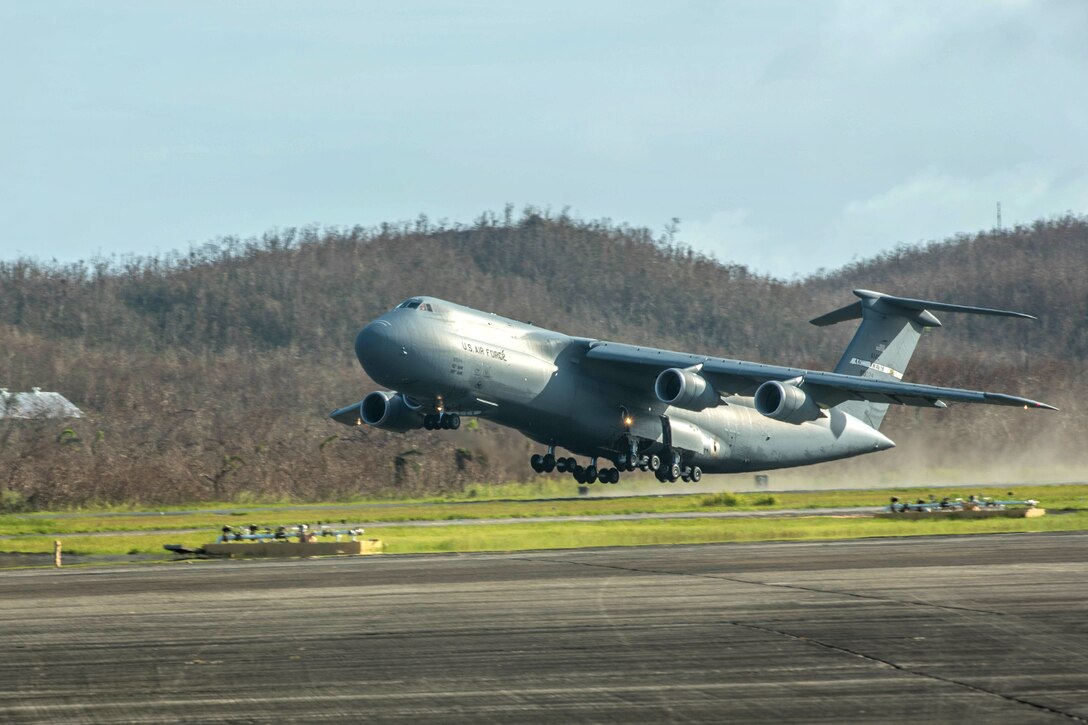 A C-5M Super Galaxy aircraft takes off from Roosevelt Roads.