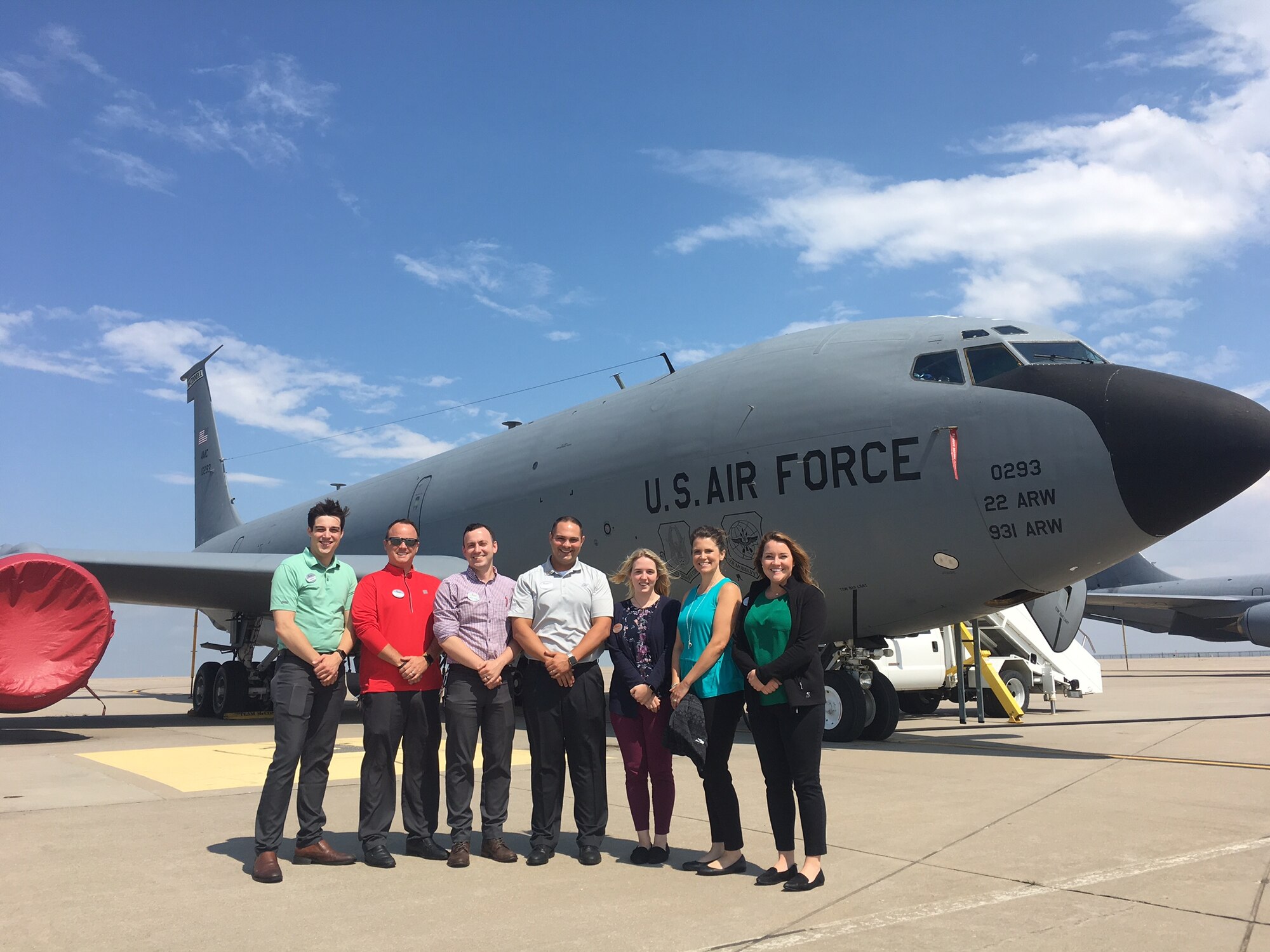 Andrew Nelson (center), 22nd Maintenance Group honorary commander, poses with his Chick-fil-A directors in front of a KC-135 Stratotanker June 27, 2017, at McConnell Air Force Base, Kansas. Nelson and his team went on a tour of the base maintenance facilities and flight line to gain a better understanding of what Airmen do day in and day out. (Courtesy photo)