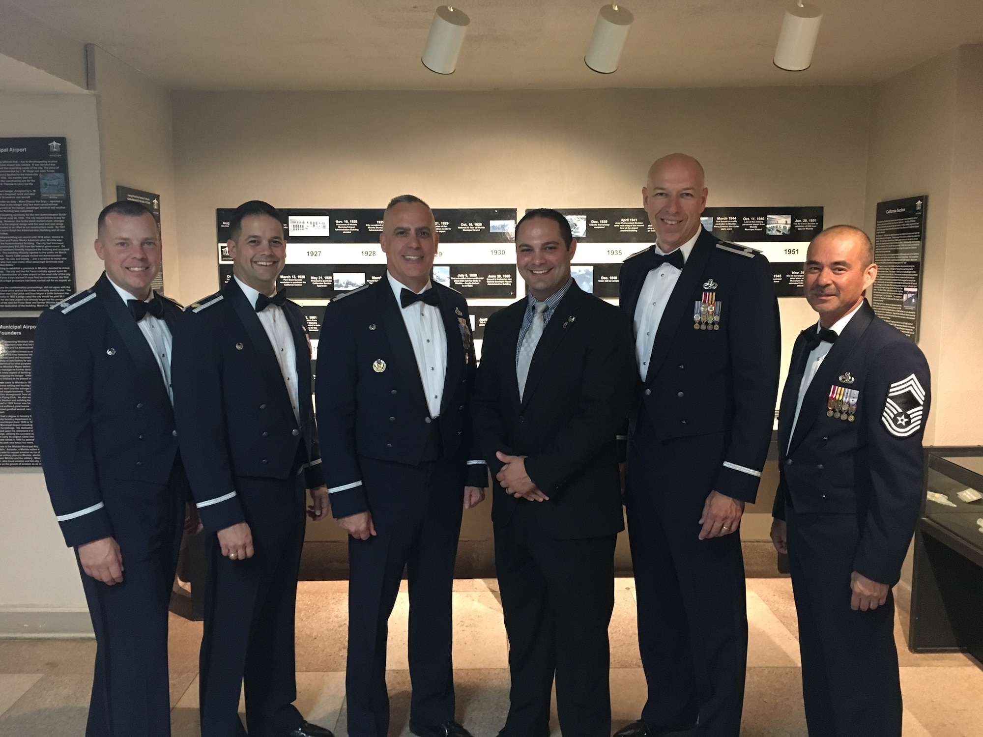 Andrew Nelson (center right), 22nd Maintenance Group honorary commander, poses with 22nd MXG leaders Sep. 16, 2017, at the Air Force Gala at the Wichita Aviation Museum, Kansas. Honorary commanders help Air Force commanders connect with their communities by improving understanding of what the Air Force does and how they help the surrounding cities. (Courtesy photo)