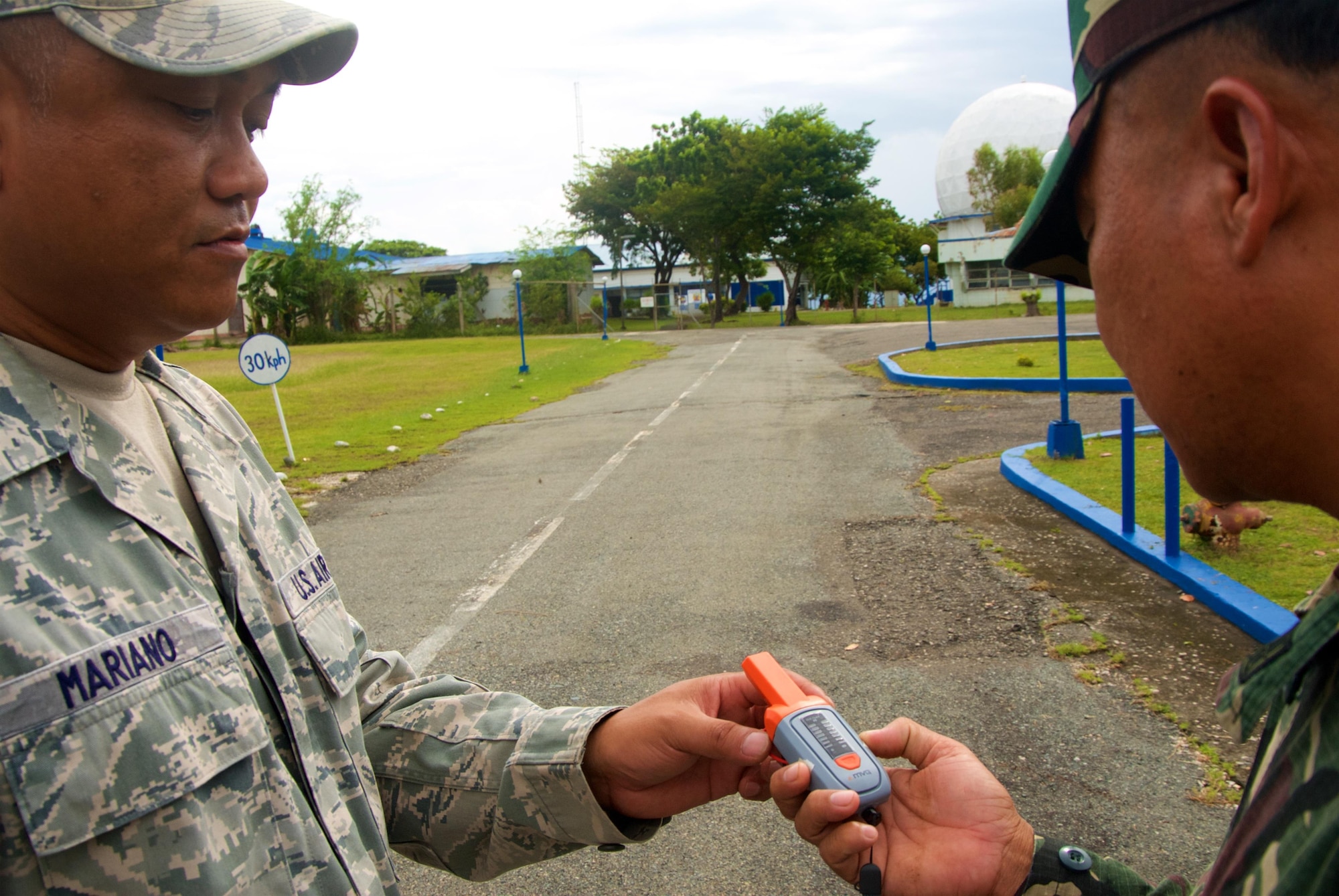 Master Sgt. Eugenio Mariano, radar maintenance technician, 169th Air Defense Squadron, explains the use of an RF Detector to Philippine Air Force Tech. Sgt. Vince Antipastia