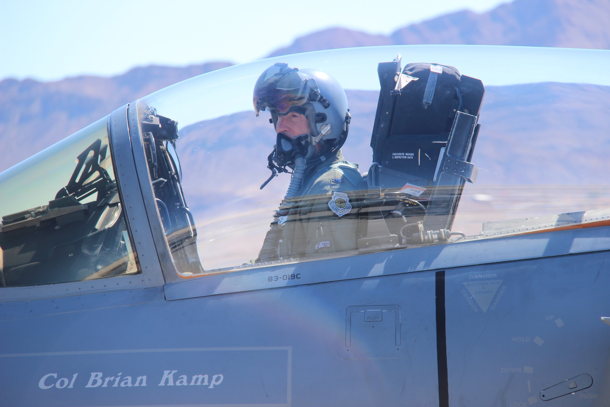 Col. Brian Kamp, Air National Guard advisor to the U.S. Air Force Warfare Center, sits in the cockpit of an F-15C Eagle September 27, 2017, at Nellis Air Force Base, Nevada. Kamp just hit the 4,000-hour mark flying an F-15C. (U.S. Air Force photo by Susan Garcia/Released)