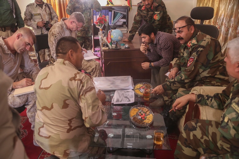 U.S. Marines with Task Force Southwest and Afghan National Army soldiers with 215th Corps discuss tactics for Operation Maiwand Six during a key leader engagement near Gereshk, Afghanistan, Sept. 25, 2017. During the operation, various elements of the Afghan National Defense and Security Forces worked to clear Gereshk and surrounding areas of insurgency in order to enhance security and stability for the local populace. (U.S. Marine Corps photo by Sgt. Lucas Hopkins)