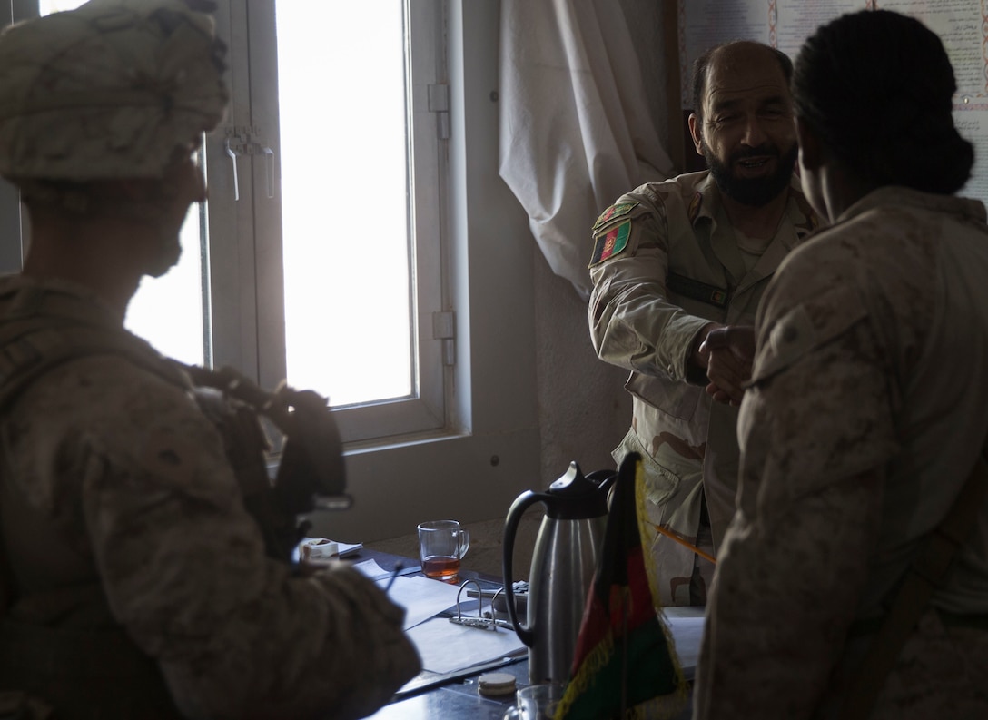 A U.S. Marine advisor with Task Force Southwest meets with the Inspector General to inquire about any known pay issues at 1st Brigade, near New Garm Ser, Afghanistan, Sept. 23, 2017. The advisor met with key leaders throughout the 1st Brigade to assist in solving any identified financial issues. As part of the new U.S. South Asia strategy, Marines are advising down to the brigade- and kandak-levels where necessary to support Afghan National Defense and Security Force operations. (U.S. Marine Corps photo by Sgt. Justin T. Updegraff)