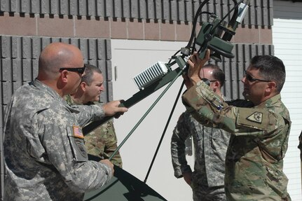 Sgt. 1st Class Ron Seagraves, left, and Sgt. 1st Class Ken Hodes, both of Joint Force Headquarters in Carson City, prepare Joint Incident Site Communications Capability equipment for transport to Puerto Rico on Sept. 27 in Carson City, Nev. The two were among six communications sergeants who departed for Puerto Rico today.