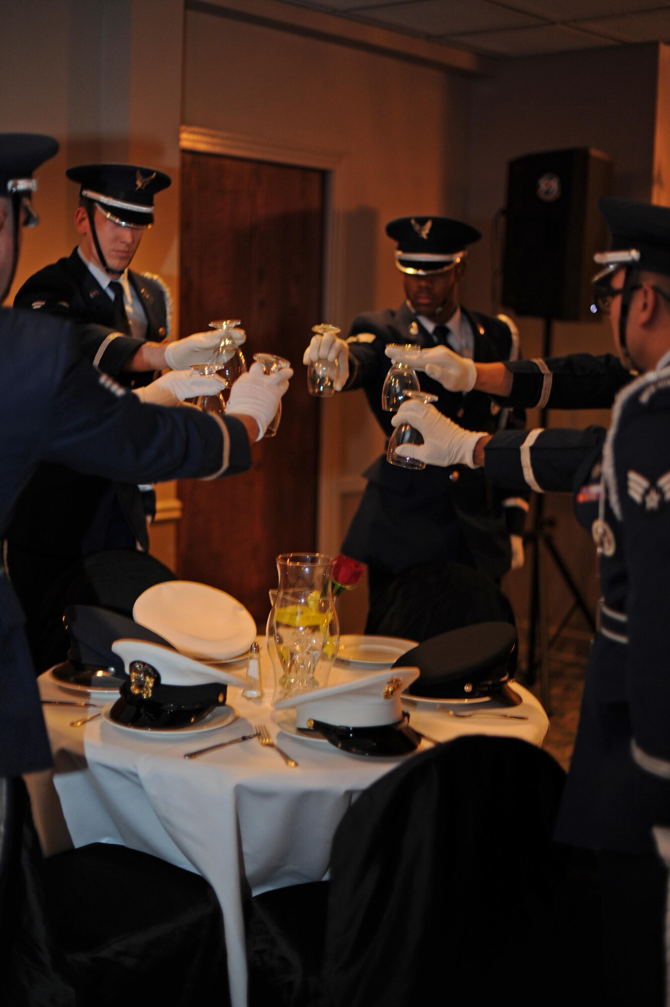 Members of the Laughlin Honor Guard set the POW/MIA dinner table at the Air Force Ball on Laughlin Air Force Base, Texas, Sept. 30, 2017.  The POW/MIA table is an observance for the military’s brothers and sisters-in-arms who were prisoners of war or missing in action during any time of conflict.