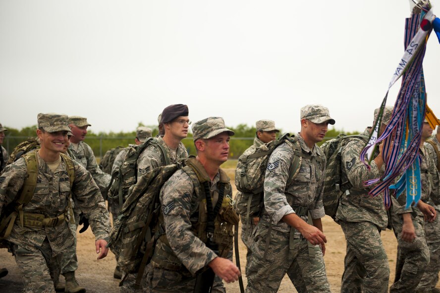 U.S. Air Force Staff Sgt. Dakoda Riddle, 17th Security Forces K9 handler, marches the perimeter during the Jacobson ruck march on Goodfellow Air Force Base, Texas, Sept. 28, 2017. The ruck march is an annual event to honor Airman 1st Class Elizabeth Jacobson for paying the ultimate sacrifice on her deployment in Iraq, 12 years ago. (U.S. Air Force photo by Senior Airman Scott Jackson/Released)