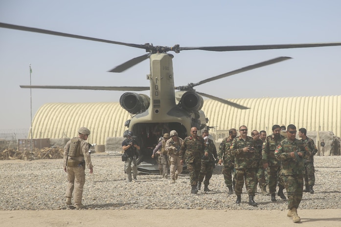 Afghan National Army soldiers with 215th Corps and U.S. Marines with Task Force Southwest disembark a CH-47 Chinook during Operation Maiwand Six near Gereshk, Afghanistan, Sept. 25, 2017. Key leaders from both forces met to discuss recent progress and develop plans for the mission. Maiwand Six combines multiple elements of the Afghan National Defense and Security Forces with advising and assistance from the Task Force, and is designed to bolster security in Gereshk and surrounding areas. (U.S. Marine Corps photos by Sgt. Lucas Hopkins)