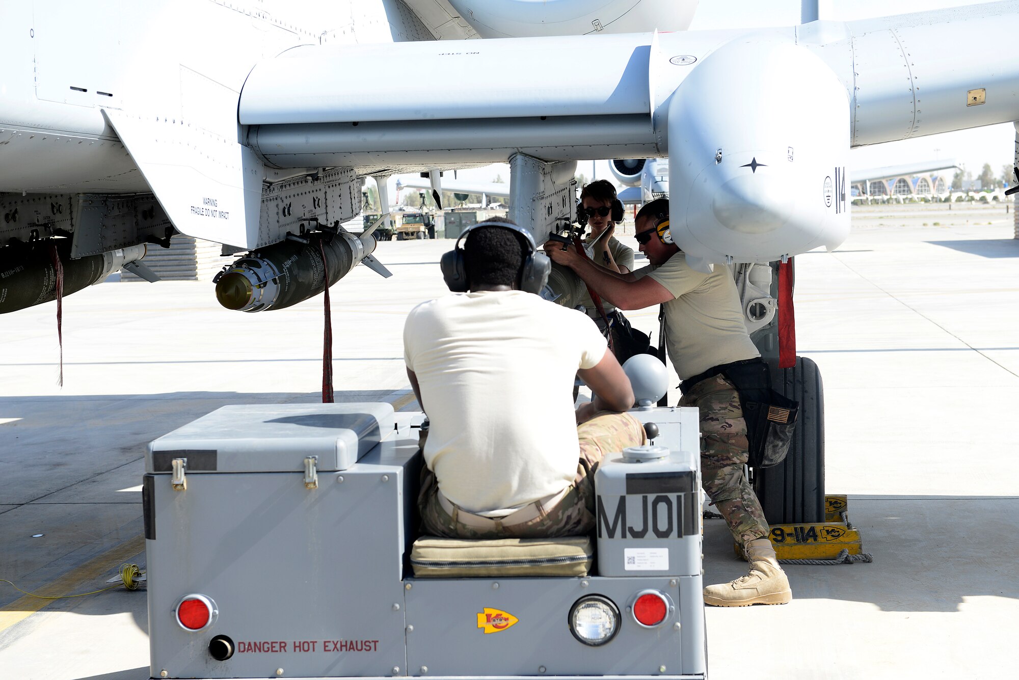 Weapons loaders assigned to the 451st Expeditionary Aircraft Maintenance Squadron, load a 500 pound GPS-guided bomb on an A-10 Thunderbolt II before a mission, March 22, 2018, at Kandahar Airfield, Afghanistan.