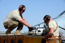 Weapons loaders assigned to the 451st Expeditionary Aircraft Maintenance Squadron, prepare to reload the 30mm gun on an A-10 Thunderbolt II before a mission, March 22, 2018, at Kandahar Airfield, Afghanistan.