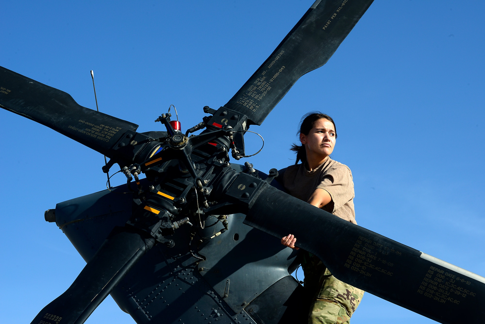 Airman 1st Class Ashley Amezola, 451st Expeditionary Aircraft Maintenance Squadron HH-60 Pave Hawk crew chief, inspects the tail rotor of a HH-60, March 23, 2018, at Kandahar Airfield, Afghanistan.