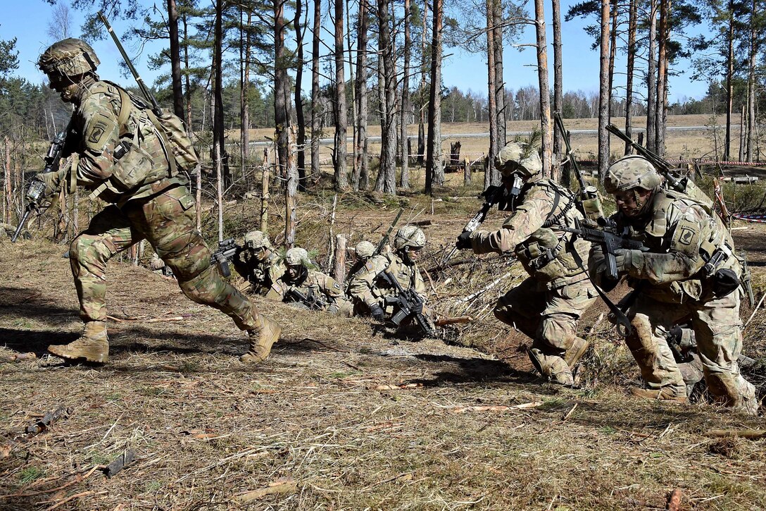 Soldiers move out to their next objective.
