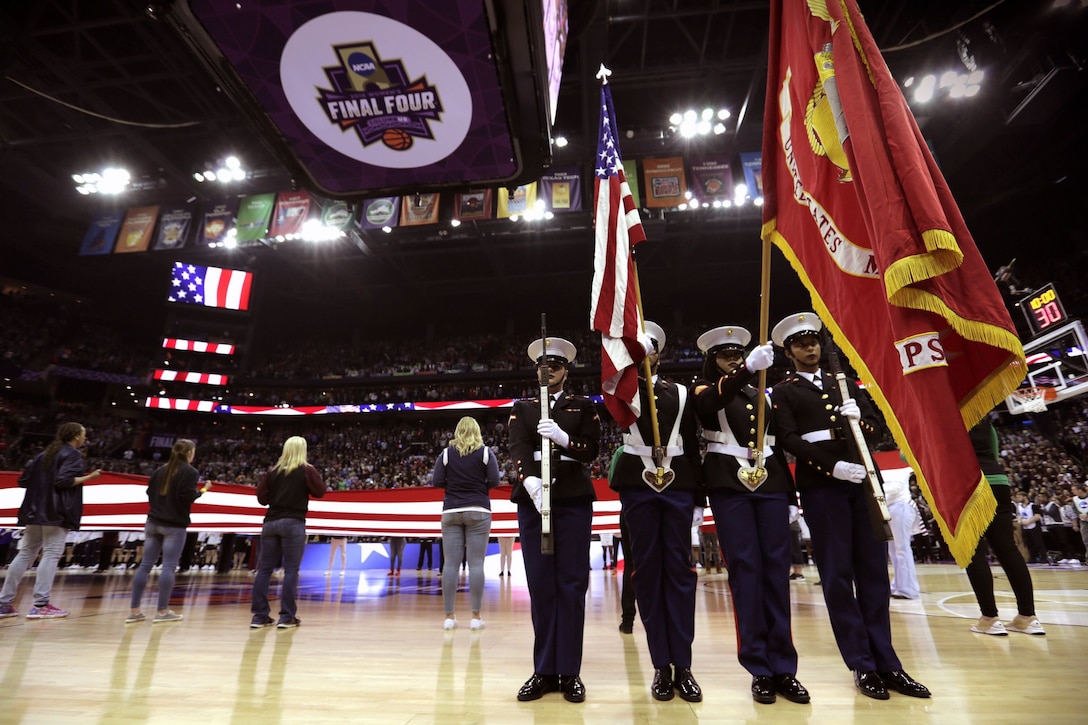 Rifle bearers Pfc. Jasmin Villagomez and Pfc. Heather Williams and color bearers Sgt. Saturnina Rodriguez and Sgt. Hope Timberlake presented the National Ensign and Marine Corps colors during the NCAA Division I Women’s Final Four Semi-finals basketball games. The games took place during the 2018 Women’s Basketball Coaches Association Convention in Columbus, Ohio.