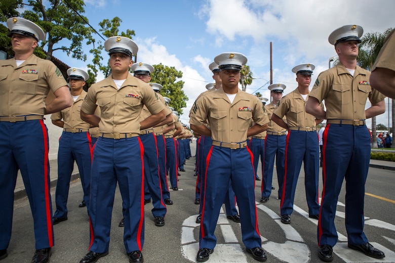 Marines and Sailors with 1st Battalion, 11th Marine Regiment, 1st Marine Division, march in the 60th Swallows Day Parade on March 24, 2018.