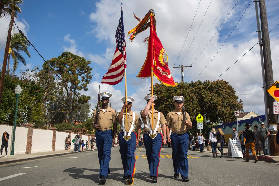 Marines and Sailors with 1st Battalion, 11th Marine Regiment, 1st Marine Division, march in the 60th Swallows Day Parade on March 24, 2018.