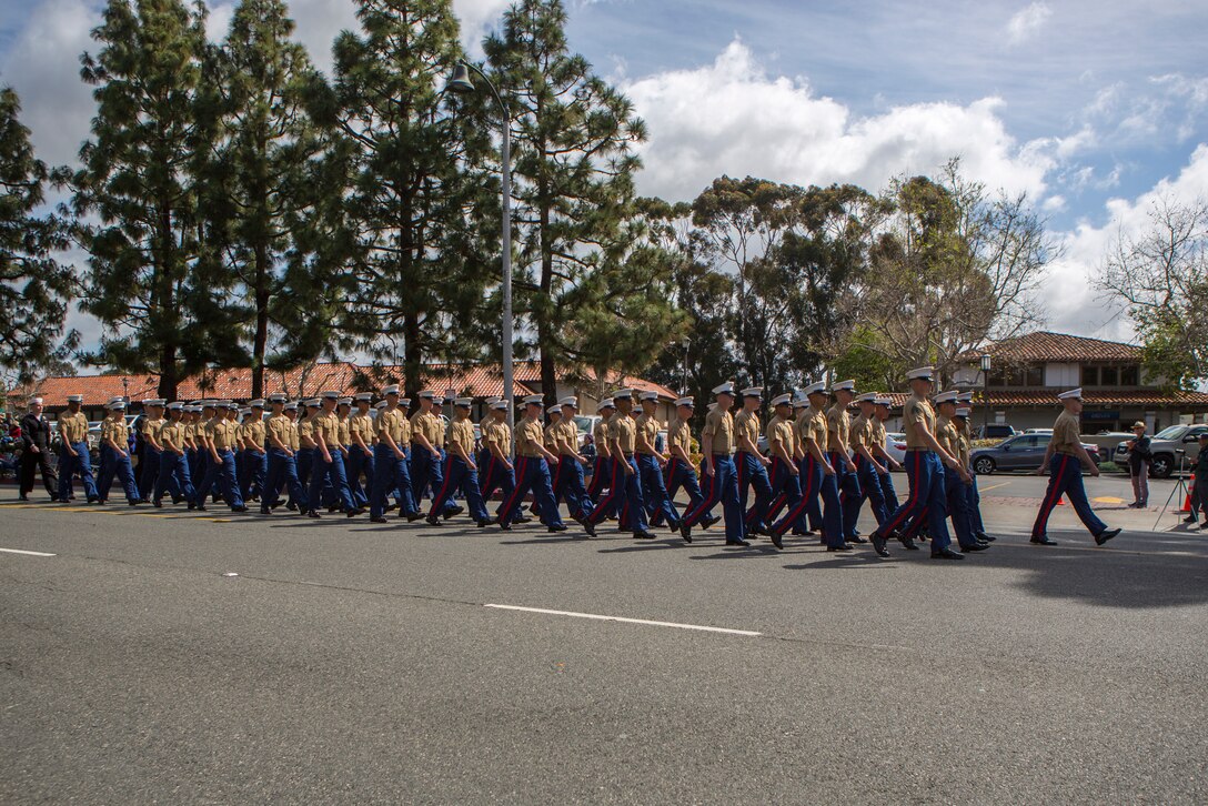Marines and Sailors with 1st Battalion, 11th Marine Regiment, 1st Marine Division, march in the 60th Swallows Day Parade on March 24, 2018.