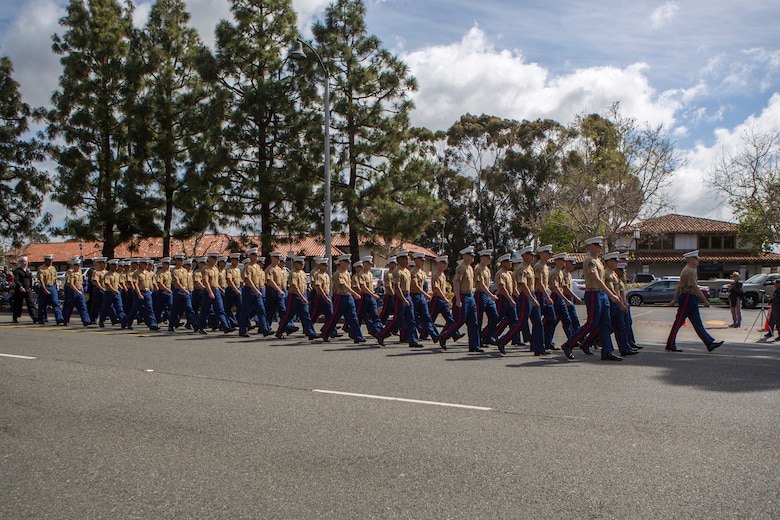 Marines and Sailors with 1st Battalion, 11th Marine Regiment, 1st Marine Division, march in the 60th Swallows Day Parade on March 24, 2018.