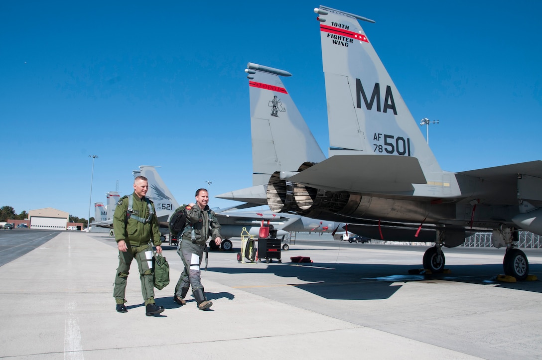 Canadian Forces Brig. Gen. Sylvain Menard, Continental US NORAD Region deputy commander, receives an orientation flight in an F-15 fighter jet and visits with air crew members during his visit to Massachusetts Air National Guard's  104th Fighter Wing at Barnes Air National Guard Base, Mar. 25, 2018. During his visit, Menard spoke to wing leadership about its homeland defense mission and its relationship with CONR to ensure continental United States aerospace control.