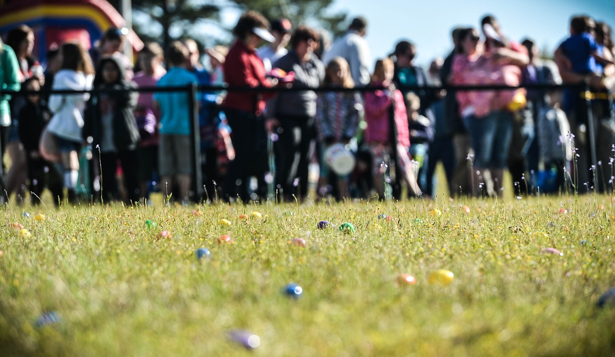 Easter eggs are scattered across a field during a Month of the Military Child celebration at Shaw Air Force Base, S.C., March 31, 2018.
