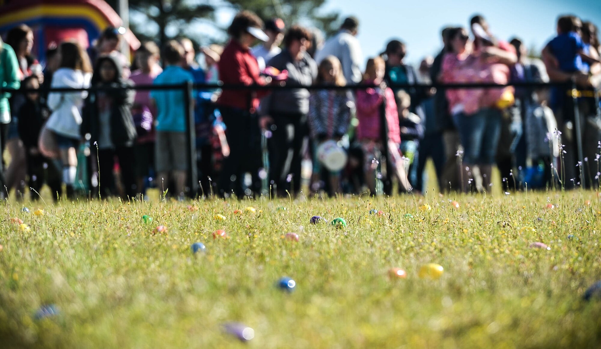 Easter eggs are scattered across a field during a Month of the Military Child celebration at Shaw Air Force Base, S.C., March 31, 2018.