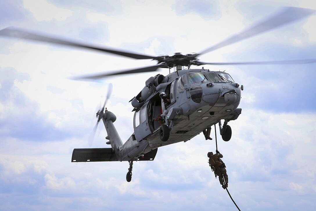 A Marine conducts fast-rope training.