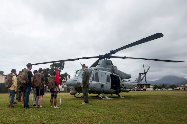 Capt. Matthew Dieska, a UH-1Y Venom helicopter pilot with Marine Light Attack Helicopter Squadron 367, Marine Aircraft Group 24, teaches a group about the functions of the aircraft during ‘Operation Ooh-Rah Kids’, Marine Corps Base Hawaii (MCBH), March 23, 2018. MCBH Marines and Sailors volunteer each year to give the children a chance to experience what it’s like to be a Marine. (U.S. Marine Corps photo by Lance Cpl. Matthew Kirk)