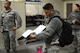 Staff Sgt. Jerry-Lee Calalang, 62nd Medical Squadron, Occupational Health NCOIC, fills out a health and safety inspection form, March 16, 2018, at Moses Lake, Wash. Inspections are performed annually to ensure that facilities and practices remain safe.