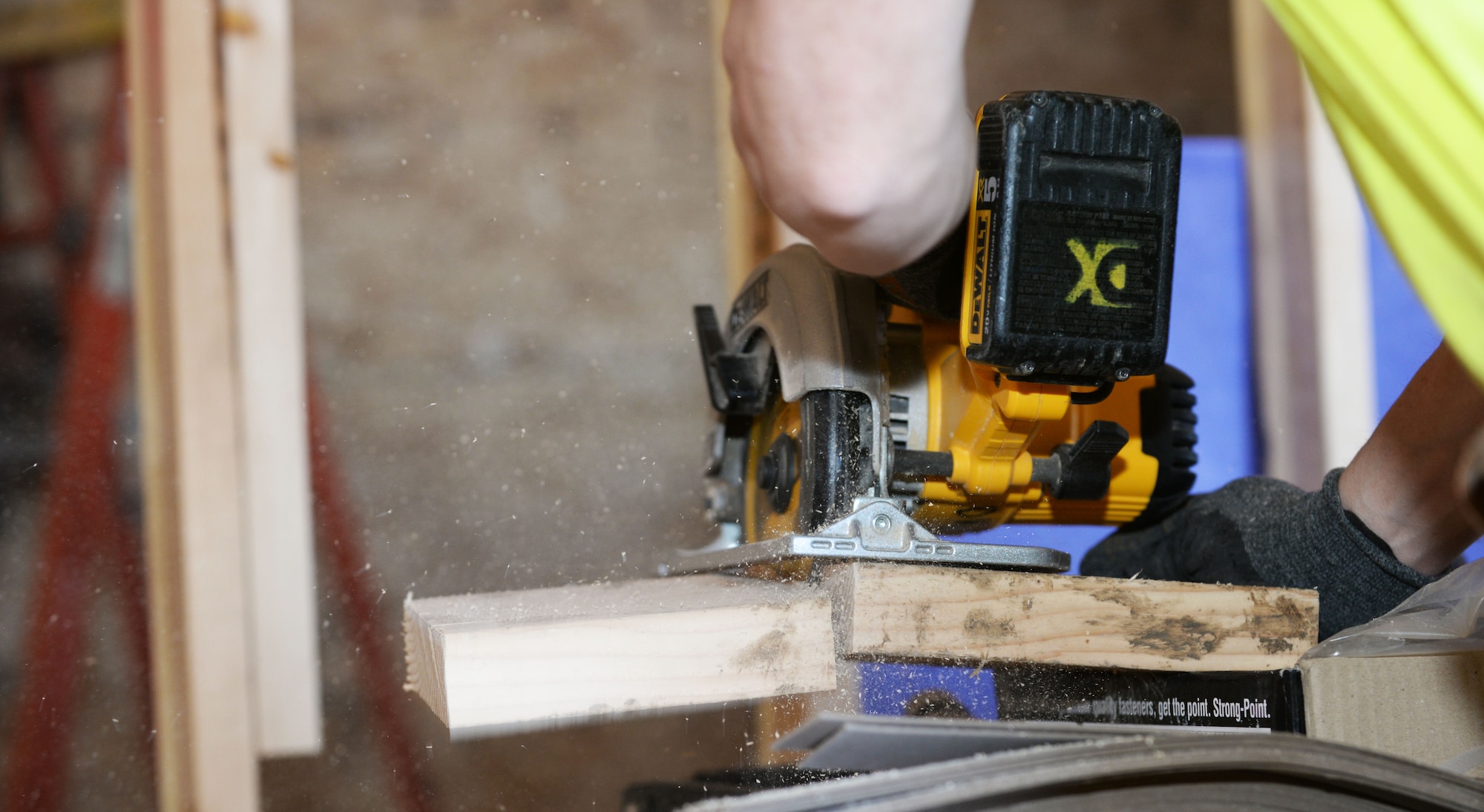 Rick Williams, a carpenter contracted by the Department of Defense, cuts a piece of wood at a dormitory construction site on Ellsworth Air Force Base, S.D., March 27, 2018. The new dormitories began construction January 2017 and are projected to be completed January 2019 at a cost of approximately $21.5 million. (U.S. Air Force photo by Airman 1st Class Thomas Karol)