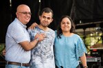 U.S. Air Force Senior Airman Jonathan Rodriguez-Maldonado, 502d Comptroller Squadron finance technician is reunited with his parents during the NCAA March Madness Final Four Music Festival on March 31, 2018. Before he could visit his family in Puerto Rico, following a deployment to Kuwait, Hurricane Maria struck the island, leaving him unable to visit his family. (U.S. Air Force photo by Senior Airman Gwendalyn Smith)