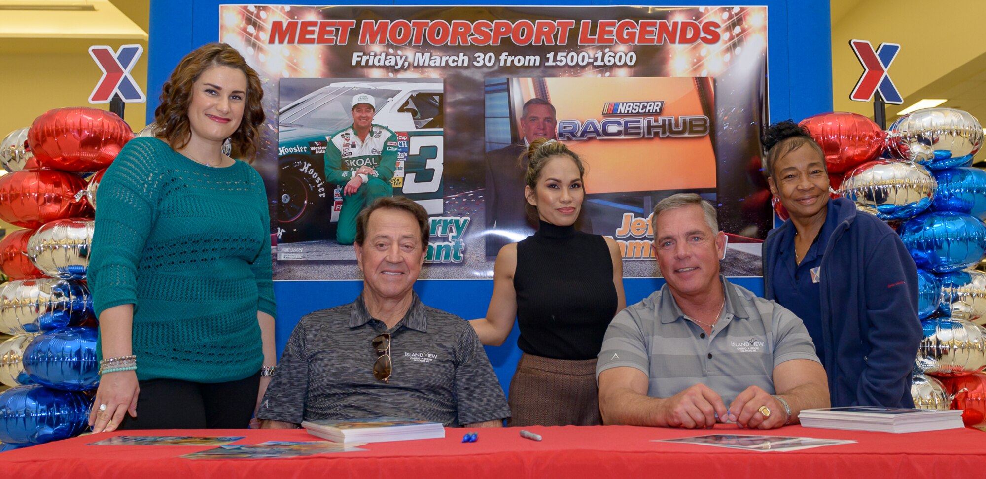 Keesler Base Exchange employees pose for a photo with Harry Gant and Jeff Hammond during the meet and greet at The Exchange March 30, 2018, on Keesler Air Force Base, Mississippi. Hammond and Gant spent the day meeting veterans at the Armed Forces Retirement Home and toured various facilities that support veterans on Keesler Air Force Base. Gant is a former NASCAR driver and Hammond is a current TV broadcaster for the motorsport. (U.S. Air Force photo by Andre' Askew)