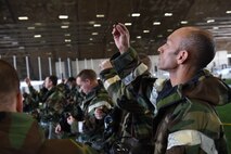 Airmen assess individual components of their gas masks during chemical, biological, radiological, nuclear and environmental training at Ellsworth Air Force Base, S.D., March 23, 2018. During the course, students learned to properly store and wear mission oriented protective posture gear, cover military assets, and test surfaces for chemical agents. (U.S. Air Force photo by Airman 1st Class Donald C. Knechtel)
