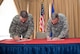 Chief Master Sgt. Randy Kwiatkowski, 56th Fighter Wing command chief, and Col. Robert Sylvester, 56th Mission Support Group commander, sign the Air Force Assistance Fund donation forms during the AFAF campaign kickoff breakfast at Luke Air Force Base, Ariz., April 2, 2018. Kwiatkowski and Sylvester made their initial contributions to the AFAF, officially starting the six-week campaign at Luke. (U.S. Air Force photo by Airman 1st Class Alexander Cook)